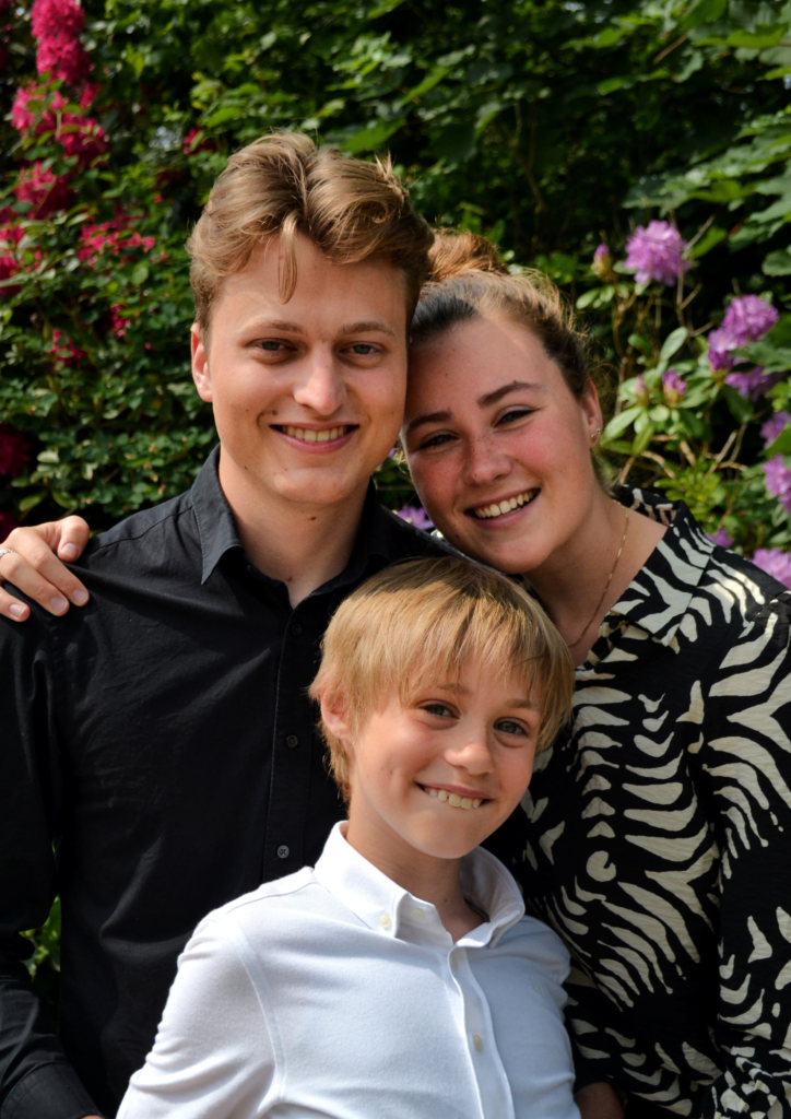 portrait of a man, a woman and a boy