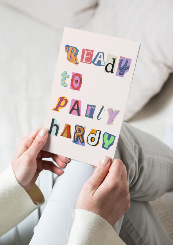 someone holding a birthday card that says ready to party hardy